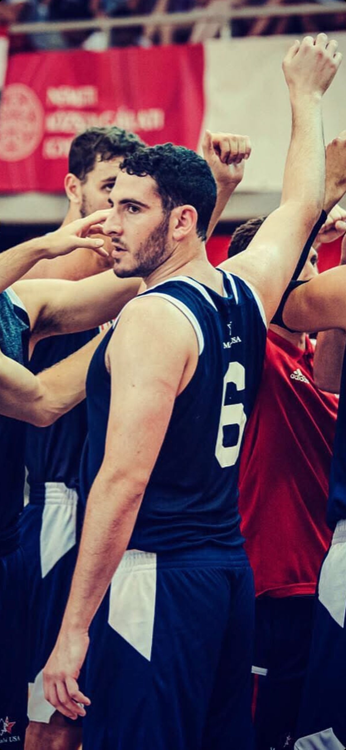 Rob on the court, #6 jersey, teammates celebrating behind him